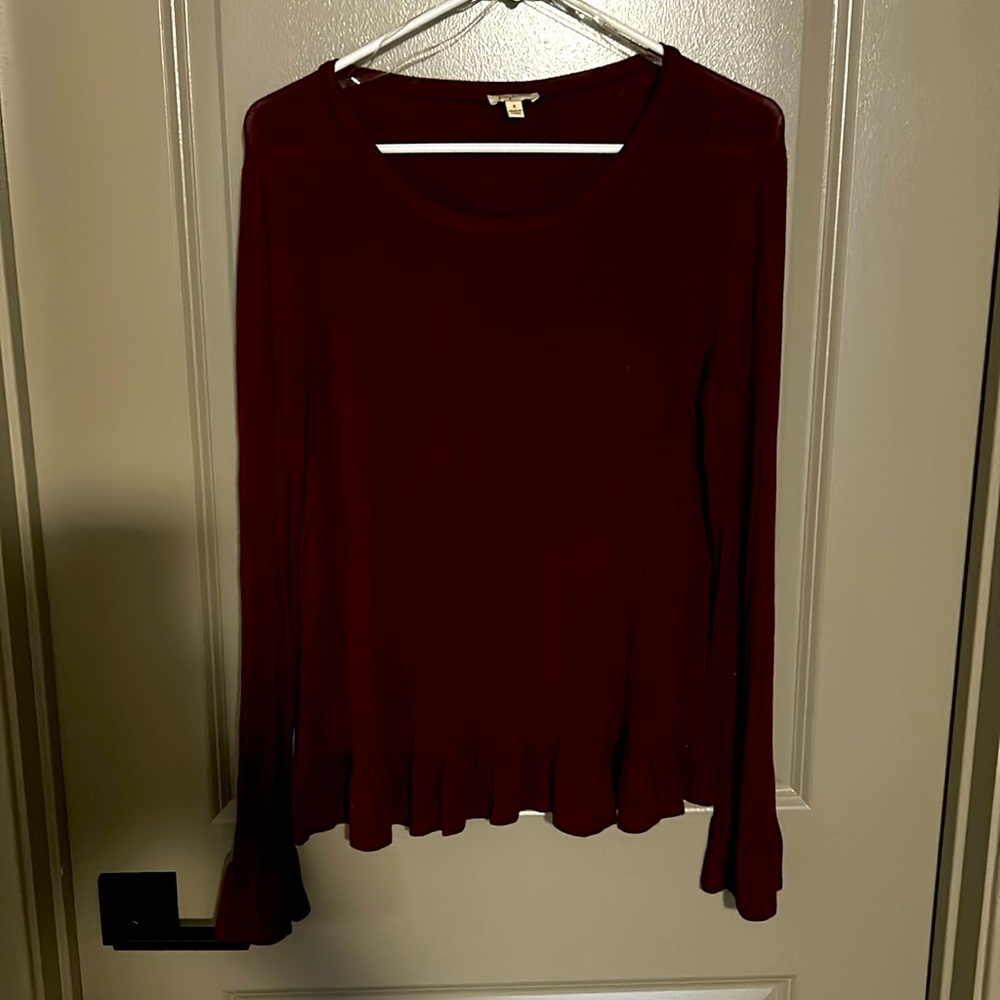Ruby colored long sleeve tee with ruffle sleeves and hem